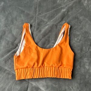 Give the label orange sports bra